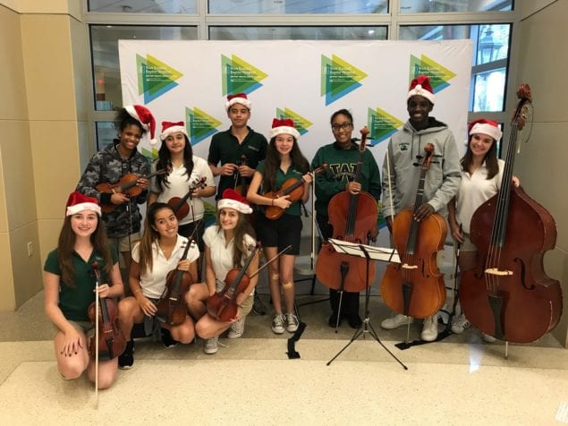 WCS Orchestra students deliver Christmas cheer to local hospital