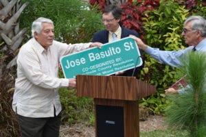 Mayor Philip Stoddard (center) and South Miami Commissioner Walter Harris honoring resident Jose Basulto.