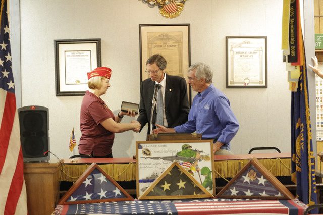 Mayor Philip Stoddard and Commissioner Walter Harris, present Commander Rohan a proclamation and key to the city.