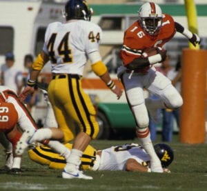 MIAMI, FL - OCTOBER 29, 1983: Albert Bentley #16 of the Miami Hurricanes carries the ball during a game against the West Virginia Mountaineers in the Orange Bowl on October 29, 1983 in Miami, Florida. (Photo by Ronald C. Modra/Sports Imagery/Getty Images)