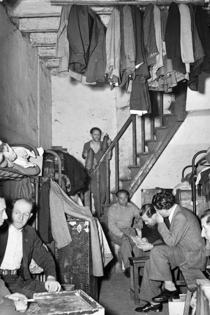 Crowded Quarters for European Refugees Hongkew, Shanghai, China. April 1946 Jammed into communal housing, German and Austrian refugees live out of steamer trunks and sleep in bunkbeds. Clothing is hung from the ceiling to save space. Photo by Arthur Rothstein