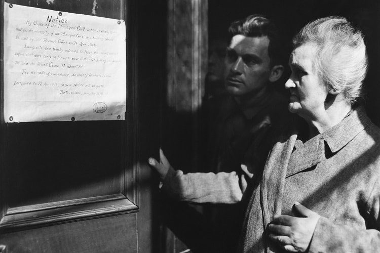 Refugees Read Eviction Notice, Hongkew, Shanghai, China (April 1946) Photo by Arthur Rothstein Hongkew refugees glumly read the Shanghai government proclamation ordering them to evacuate their homes. Even after the war ended refugees were engaged in the daily struggle to maintain a minimum dignified existence. This eviction notice was posted unexpectedly, directing residents to move during Passover. Relief officials from UNRRA later secured a cancellation of the order.