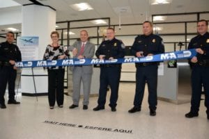 Miami-Dade County Commissioner Rebeca Sosa, Miami-Dade Aviation Director Lester Sola, CBP Executive Assistant Commissioner Todd Owen, and CBP Miami Port Director Christopher Maston cut the ceremonial ribbon for the new Concourse E passport screening facility at MIA. 