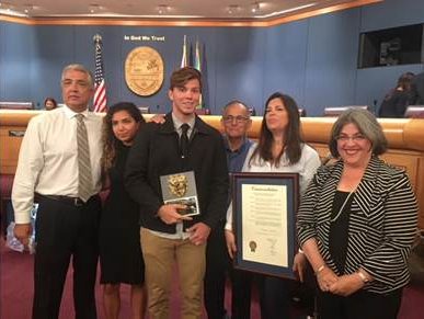 Student recognized for saving the life of a county employee