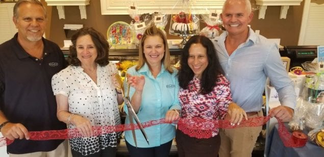 North Miami and North Miami Beach officials cut red ribbon for Nothing Bundt Cakes