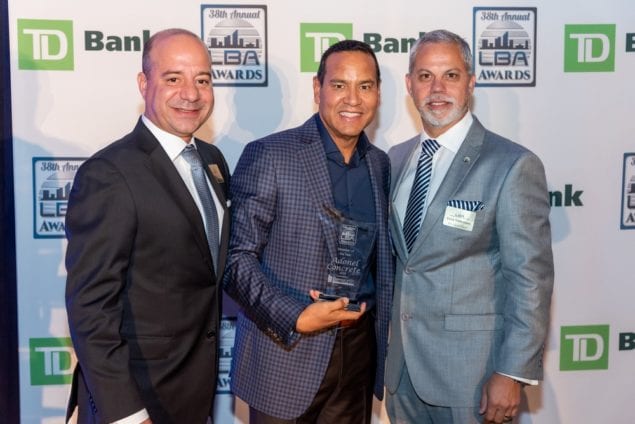 Luis Garcia, CEO and chair of Adonel Concrete (center), accepts the LBA’s “Member of the Year” award from LBA president Eric Montes de Oca (left) and president-elect Erick Valderrama.