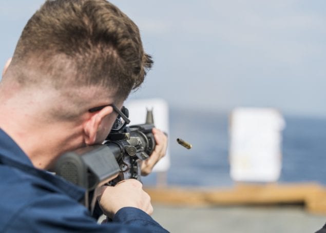 Miami Sailor fires M4 carbine during Navy Handgun Qualifications Course