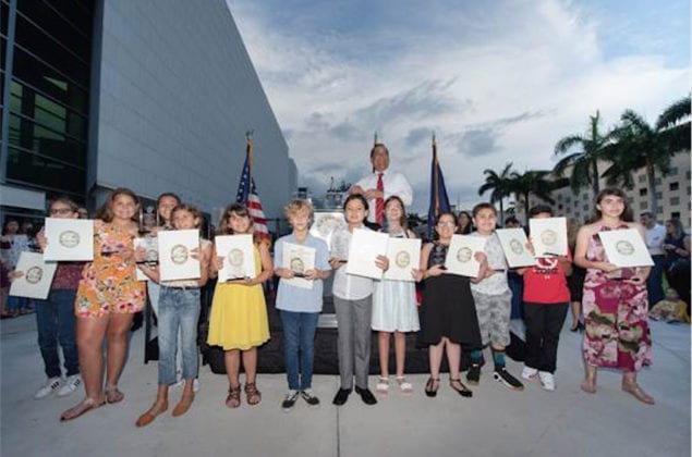 Miami-Dade County Commissioner Joe A. Martinez presents certificates and trophies to the group project winners. (Photo by Ryan Holloway/Miami-Dade County)