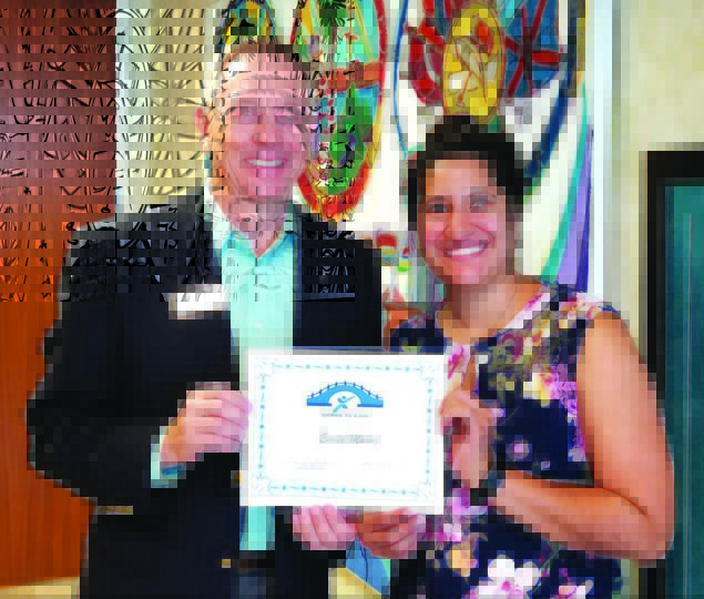 Express Employment Pros presents “Bridge to a Job” certificate to Emily Munoz