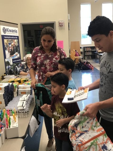 Biscayne Bay Kiwanis Distributes 100 backpacks, school uniforms, supplies