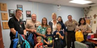 Ocaquatics Swim School joins village to distribute backpacks Ocaquatics Swim School joins village to distribute backpacks