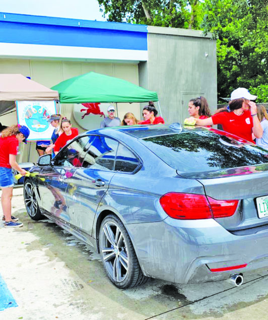 Children for Children has car wash for charity