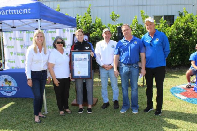 Pictured (l-r) are Village Mayor Karyn Cunningham, Miami-Dade Commissioner Daniella Levine Cava, Coach Jill Ellis, Vice Mayor John DuBois, Councilmembers David Singer and Patrick Fiore.