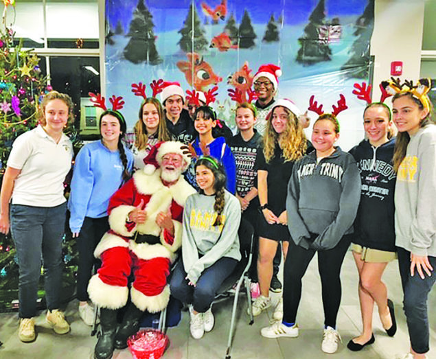 Palmer Trinity School hosts fifth annual holiday party at Chapman Partnership