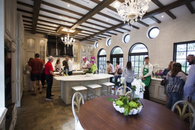 Guests visit kitchen at home of Rod Hildebrant and Matthew Meehan.