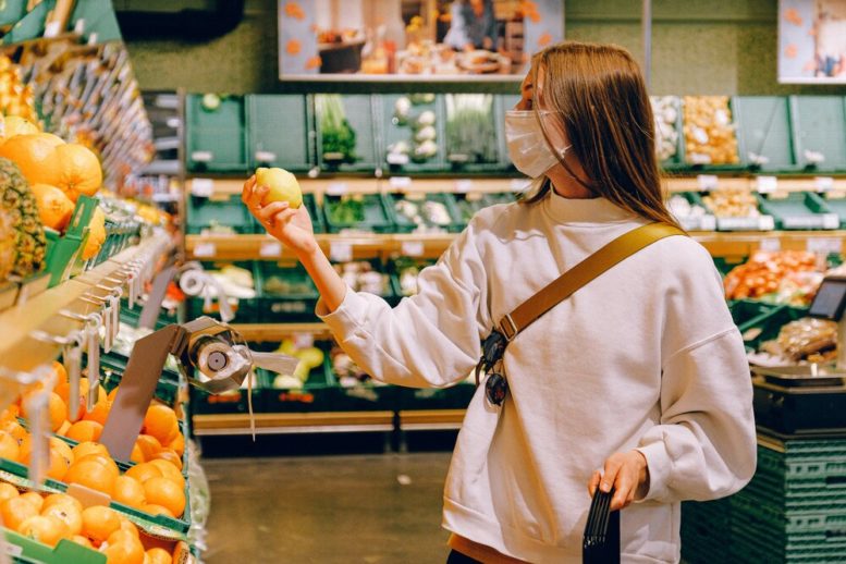 woman-in-white-long-sleeve-shirt-holding-lemon-fruit-3962290.jpg