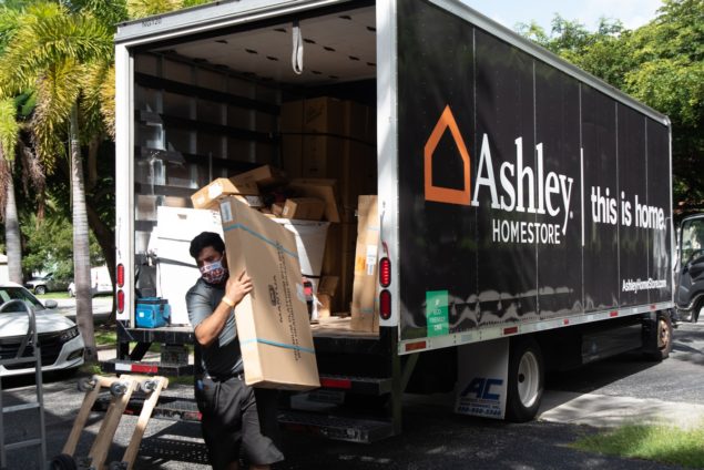 Ashley HomeStore donates 50 twin bed frames, mattresses to hospital, families
