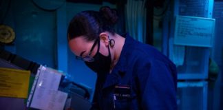 Miami Sailor stands watch aboard Navy aircaft carrier Miami Sailor stands watch aboard Navy aircaft carrier