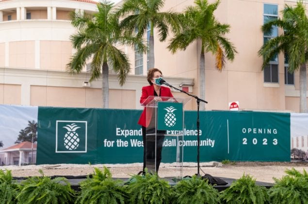 West Kendall Baptist Hospital CEO Lourdes Boue addresses the community as the hospital breaks ground on clinical expansion.