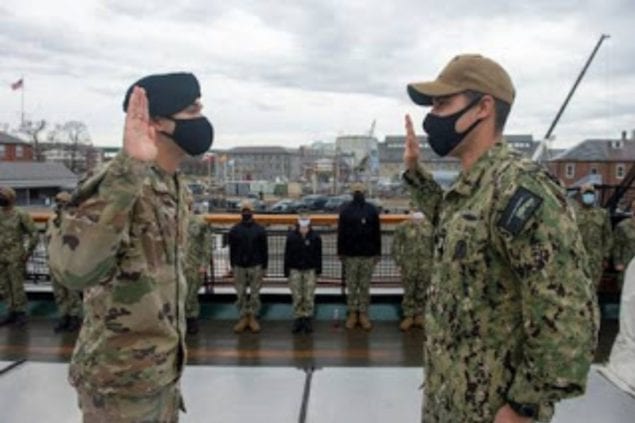 Miami native reenlists in Navy as his son administers oath