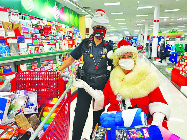 Santa and police shop for $600 worth of toys for foster children