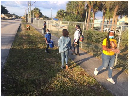 Carver Ranches Torch Club Panthers pause for a pose during Club cleanup.