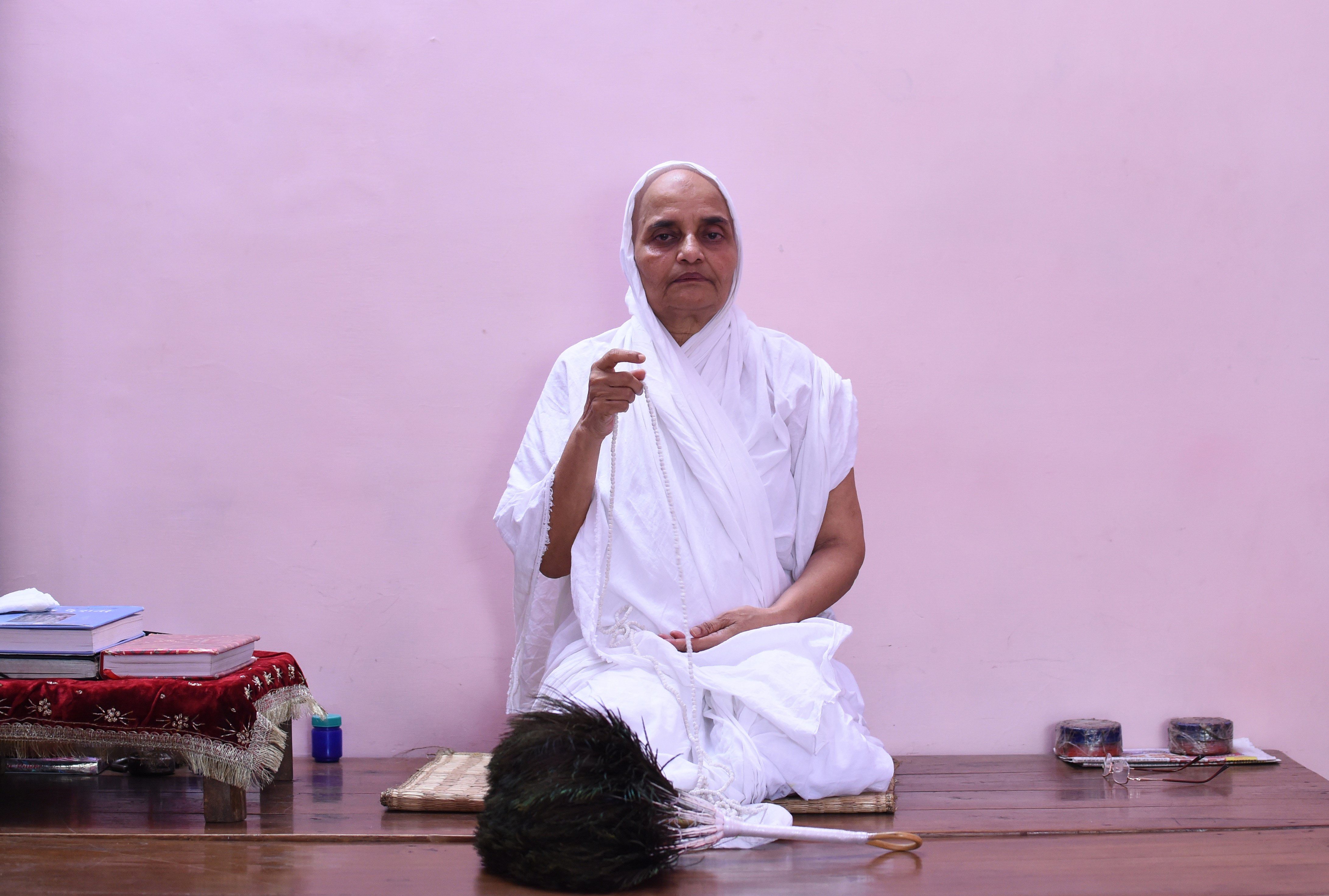 A Jain nun prays in a room at the Jain Temple in the old quarters of New Delhi.