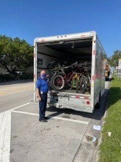 ORNA Security and Biscayne Cove ‘rain sunshine’ over North Miami Beach Sr. High with bike donation