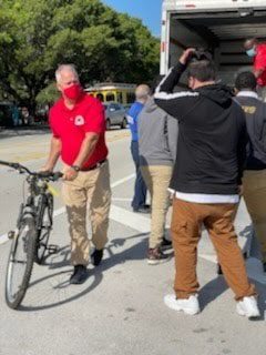 ORNA Security and Biscayne Cove ‘rain sunshine’ over North Miami Beach Sr. High with bike donation