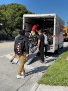 ORNA Security and Biscayne Cove ‘rain sunshine’ over North Miami Beach Sr. High with bike donation