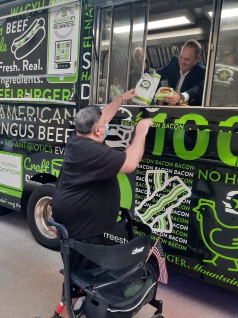 BurgerFi delivers 200 meals to veterans at Camillus House
