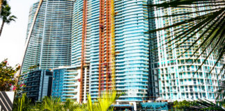 Aston Martin Residences takes its place in the Miami skyline Aston Martin Lagonda and global property developer G&G Business Developments are celebrating the topping out of the stunning Aston Martin Residences at 300 Biscayne Boulevard Way in Miami. The luxury residential tower now reaches all the way to the 66th and final residential floor and has taken its place in the Miami skyline. Built on one of the last parcels of developable land on the Downtown Miami waterfront, Aston Martin Residences offers 391 luxury condominiums and penthouses with spectacular panoramic vistas of Biscayne Bay and the Atlantic Ocean. The striking sail-shaped tower, set to be one of Miamis most sought-after residential addresses when it is completed in 2022, has enjoyed enviable sales success and is now almost 80 percent sold. “When we acquired the land, our vision was to build a new landmark, a love letter to Miami and a new benchmark in ultra-luxury living,” said Germán Coto, CEO of G&G Business Developments. “I'm delighted that the reality is even more magnificent than the vision. To see the Aston Martin Residences reach the top floor fills me with pride. The whole team has worked tirelessly to ensure we are on time, and the craftsmanship is exquisite. Every detail has been carefully considered to translate Aston Martins iconic and timeless design language into the ultimate luxury residential development.” Marek Reichman, executive vice president and chief creative officer at Aston Martin Lagonda, said, “This is a wonderful moment in the development of Aston Martin's first-ever real estate partnership. It is one thing to look at the structure as drawings and models but to see this magnificent tower reach its full height is incredible. This collaboration has given Aston Martin the opportunity to define ultra-luxury in the residential space with unique and exclusive designs, exquisite materials and detailed craftsmanship, always with an eye on the balance between beauty and performance,” Reichman added. Aston Martin Residences features over 42,000 square feet of carefully considered sky amenities. Located across four floors near the top of the majestic tower, every resident will enjoy incredible panoramic views while experiencing a suite of wellness activities designed for mind, body, and soul. A private super-yacht marina, permanent art gallery and a 24/7 butler service complete the Aston Martin Art of Living at this one-of-a-kind property.