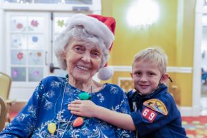 Scouts bring holiday cheer to The Palace Gardens residents