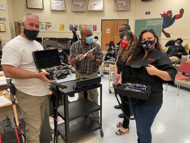 Orna Security donates instruments to North Miami Beach Sr. High School By Elaine Adler Members of the Aventura Marketing Council/Chamber of Commerce have long been hearing about the many needs of students enrolled at North Miami Beach Senior High School.  The school has a  Community Store where not only the students and their families can select clothing, household goods and even furniture free of charge, but so can the entire community.  It’s a great feeling to know that whatever you donate will be so appreciated and so needed! Belina Nagar, Founder of ORNA Security in Aventura, had already partnered with Biscayne Cove Condo Association to donate clothing and furniture to the NMB Community Store.   When Nagar found out that the school had basically no music programs because they couldn’t afford to buy instruments, she decided to do something about it. She found a source for good used instruments, purchased them and recently presented them to the school with Principal Randy Milliken, Special Education Teacher Veronica Martin and Band Teacher James Lockhart. Martin said, “ In a time when instructional music programs are shrinking or closing down due to budget constraints, the Music Department at North Miami Beach never expected to receive a donation of six clarinets, a flute, four violins, a keyboard and a 32- key xylophone.  This generous donation came from Belina Garazi owner of Orna Security, after she heard that not all the music students at NMB can afford to rent or buy an instrument and the school inventory is badly worn or nonexistent.   Many of these students have had few opportunities to experience live music--they learn about music history and the sound a particular musical instrument should make.  For years,  many of our students have not had tangible instrument experience.  During past performances, they have had to share instruments due to economic hardship.  Ms. Garazi made a commitment to help enrich and support our music program.   On behalf of the students and staff of North Miami Beach Senior we want to express our heartfelt appreciation to Belina Garazi for her support.  We are very grateful for the musical instruments donation and the opportunity to continue the music program for our young people.  We also want to thank Aron Adler for finding these instruments—all of them in great working order--  and the Aventura Marketing Council/Chamber of Commerce for organizing this community effort.”  North Miami Beach Senior High School is located at 1247 NE 167th Street, North Miami Beach 33162. 305.949.8381    