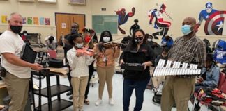 “Let there be music!” And there is…thanks to Orna Security Orna Security donates instruments to North Miami Beach Sr. High School By Elaine Adler Members of the Aventura Marketing Council/Chamber of Commerce have long been hearing about the many needs of students enrolled at North Miami Beach Senior High School. The school has a Community Store where not only the students and their families can select clothing, household goods and even furniture free of charge, but so can the entire community. It’s a great feeling to know that whatever you donate will be so appreciated and so needed! Belina Nagar, Founder of ORNA Security in Aventura, had already partnered with Biscayne Cove Condo Association to donate clothing and furniture to the NMB Community Store. When Nagar found out that the school had basically no music programs because they couldn’t afford to buy instruments, she decided to do something about it. She found a source for good used instruments, purchased them and recently presented them to the school with Principal Randy Milliken, Special Education Teacher Veronica Martin and Band Teacher James Lockhart. Martin said, “ In a time when instructional music programs are shrinking or closing down due to budget constraints, the Music Department at North Miami Beach never expected to receive a donation of six clarinets, a flute, four violins, a keyboard and a 32- key xylophone. This generous donation came from Belina Garazi owner of Orna Security, after she heard that not all the music students at NMB can afford to rent or buy an instrument and the school inventory is badly worn or nonexistent. Many of these students have had few opportunities to experience live music--they learn about music history and the sound a particular musical instrument should make. For years, many of our students have not had tangible instrument experience. During past performances, they have had to share instruments due to economic hardship. Ms. Garazi made a commitment to help enrich and support our music program. On behalf of the students and staff of North Miami Beach Senior we want to express our heartfelt appreciation to Belina Garazi for her support. We are very grateful for the musical instruments donation and the opportunity to continue the music program for our young people. We also want to thank Aron Adler for finding these instruments—all of them in great working order-- and the Aventura Marketing Council/Chamber of Commerce for organizing this community effort.” North Miami Beach Senior High School is located at 1247 NE 167th Street, North Miami Beach 33162. 305.949.8381