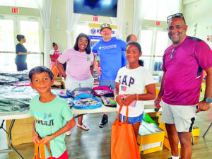 Kiwanis Club, other groups participate in school supplies distribution events