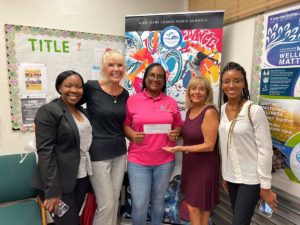 CGWC delivers checks to Frances S. Tucker Elementary and Dr. Marvin Dunn Academy