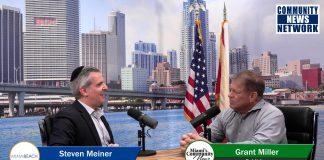 Steven Meiner, Miami Beach Commissioner, talks with Grant Miller