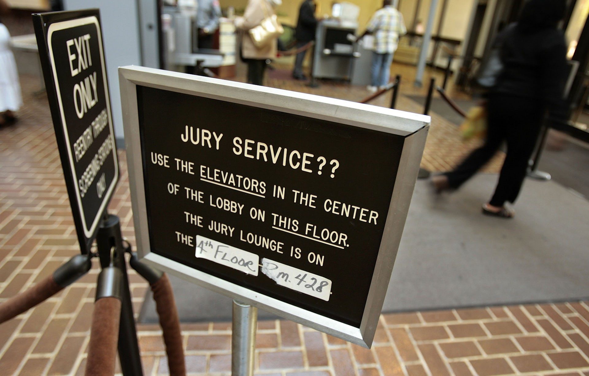 sign directing juror where to report for their service