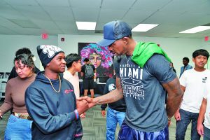 Haslem discusses mental health with students at book launch