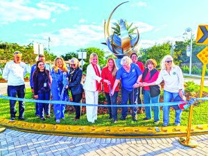 Village has ribbon cutting for traffic circle sculpture