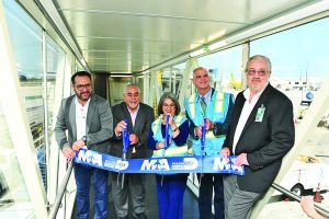 County unveils newest glass boarding bridge at Mami International Airport