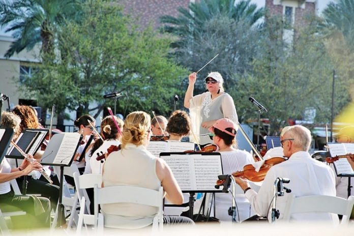 Maestro Elaine Rinaldi leads Orchestra Miami during a recent performance.