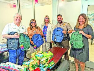 Village takes backpacks, supplies to area schools