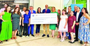 Tax Collector presents $20,500 check to support elementary school visual arts programs