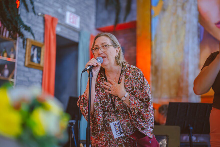 Lori Bakkum, executive director of Power Access and the South Beach Jazz Festival, speaks at a recent festival event. Founded by Power Access, the festival marks its 10th anniversary