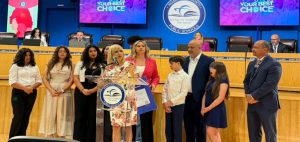 School Board’s Rojas honors S. Miami High band director